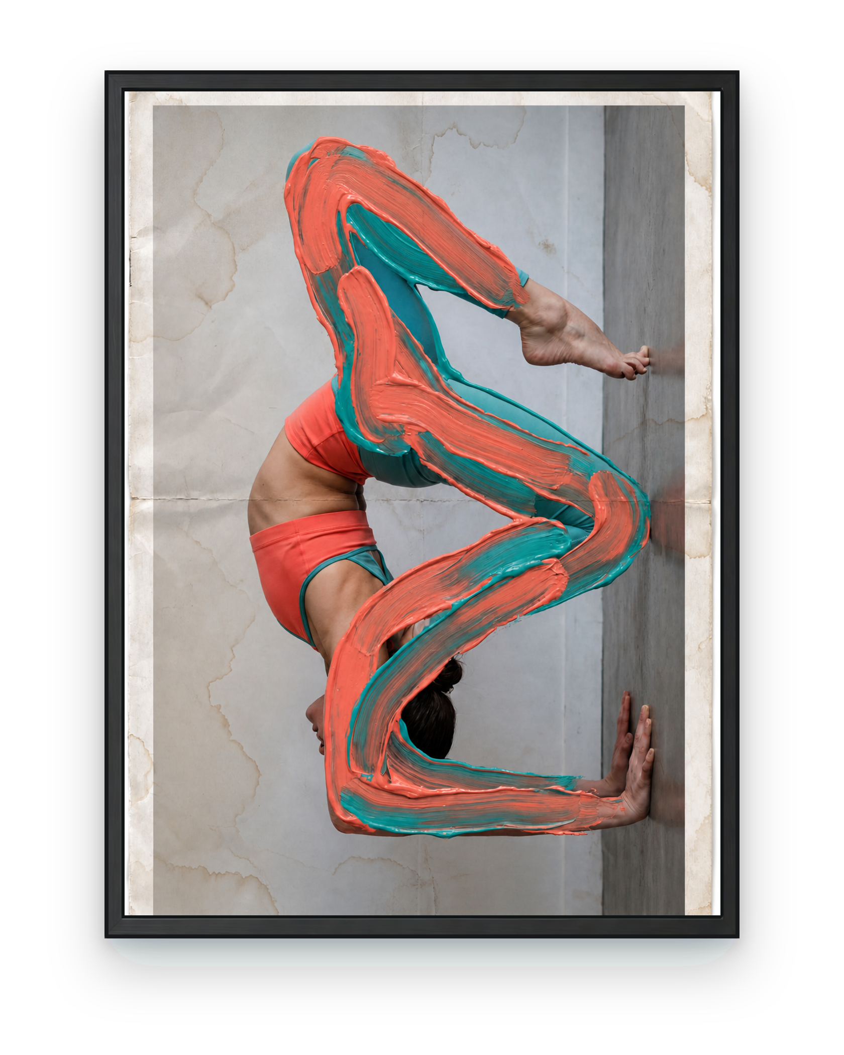 Coral and teal painted contortion figure, shown in a black frame
