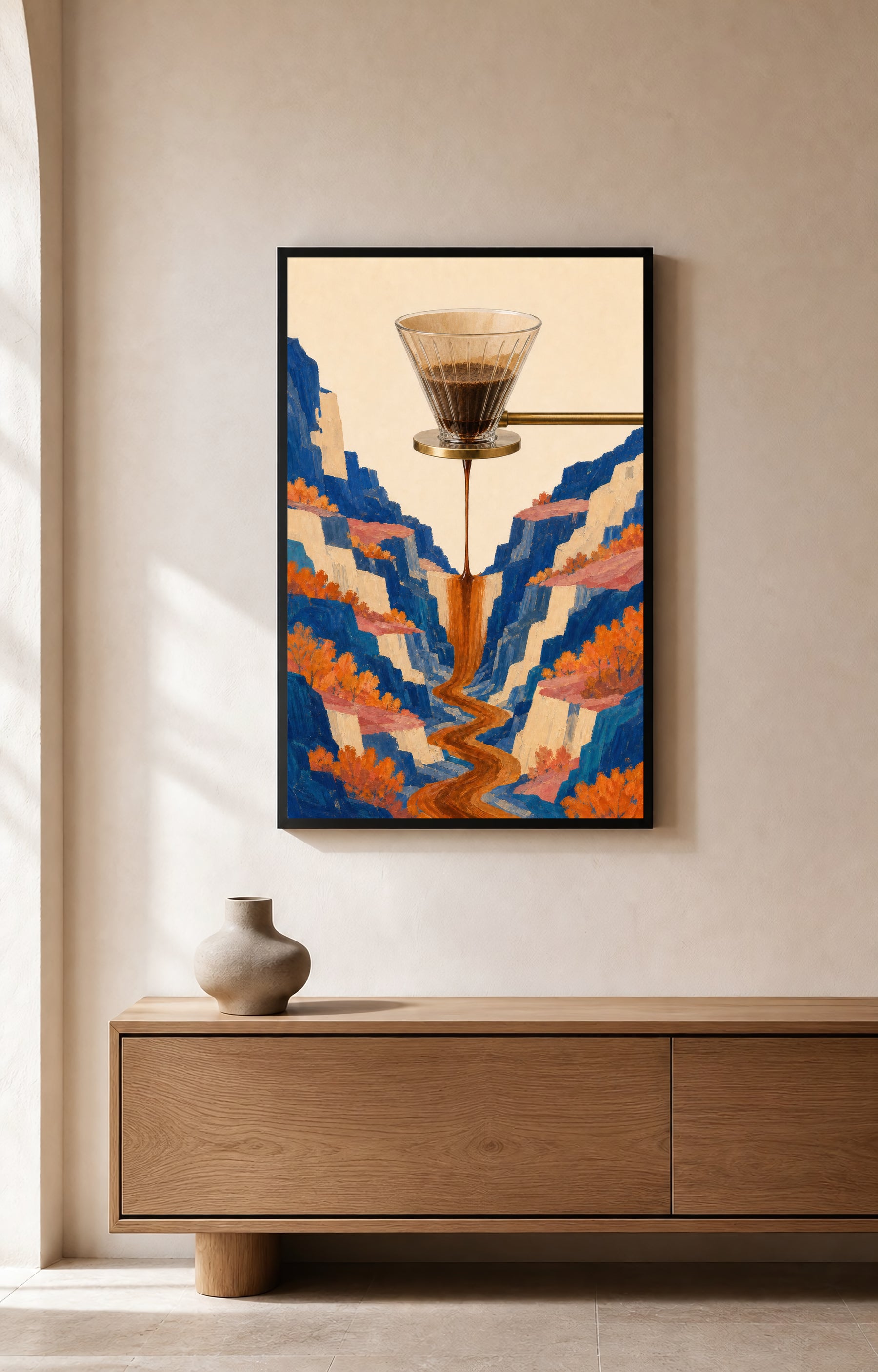 A glass pour-over dripper sends a coffee waterfall through a cobalt canyon with cream cliffs, coral ledges, and orange foliage.